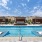 Resort-style swimming pool with lounge seating