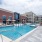 Resort-style swimming pool with lounge seating